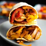 stack of two cajun chicken wraps on blue plate