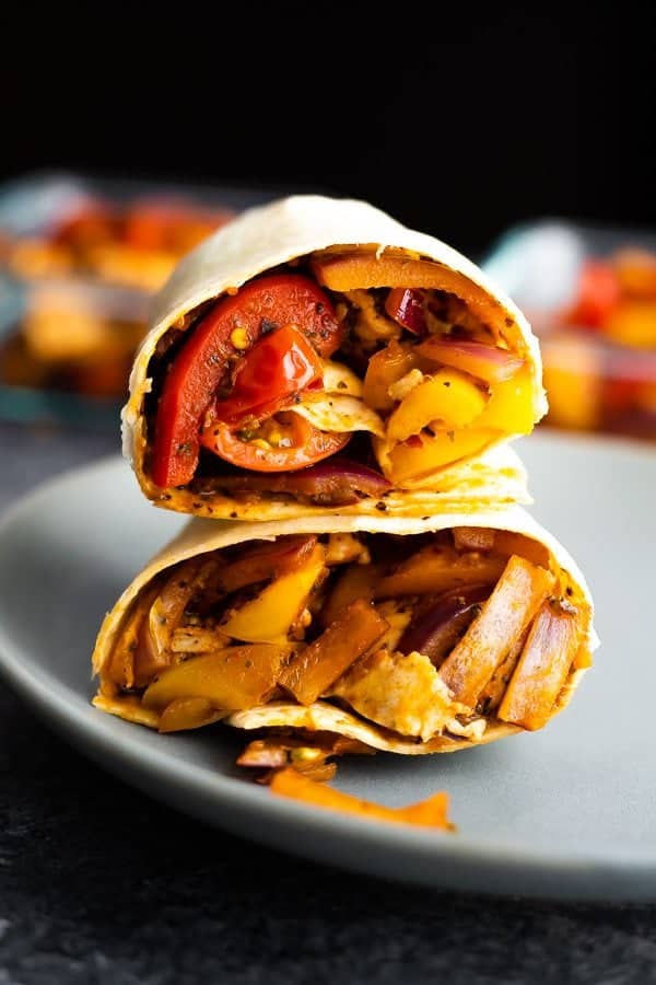 stack of two cajun chicken wraps on blue plate