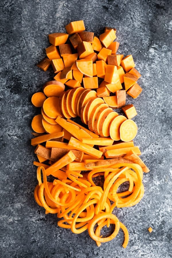 overhead view of sweet potatoes cut in many ways to show how to cook sweet potatoes