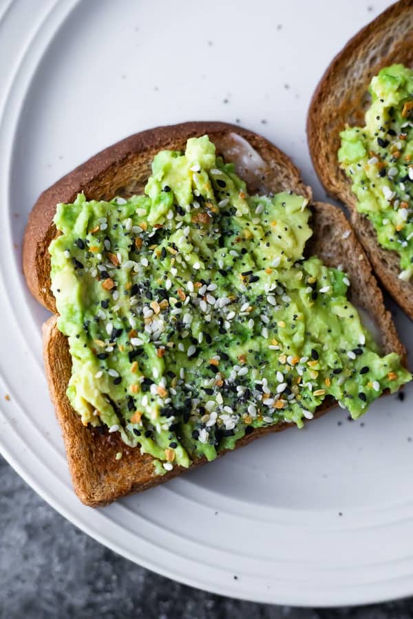 avocado toast shown as how to eat an avocado