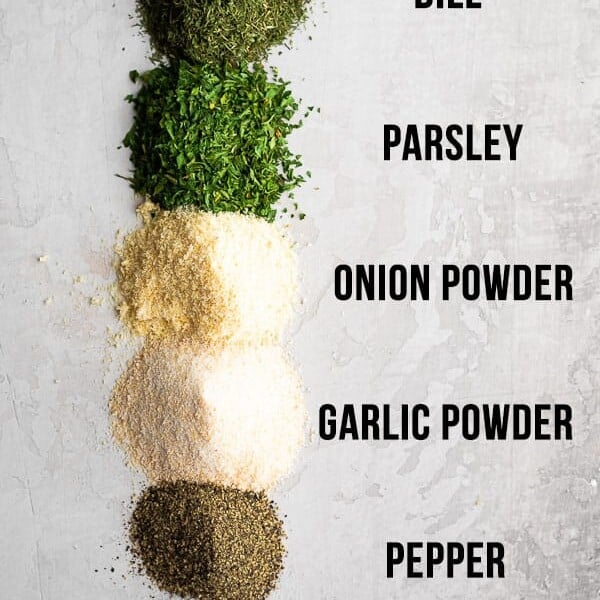 ingredients for homemade ranch seasoning on white background and labeled