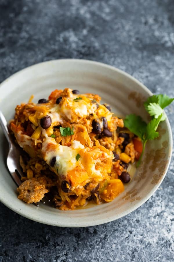 spaghetti squash casserole in bowl with fork