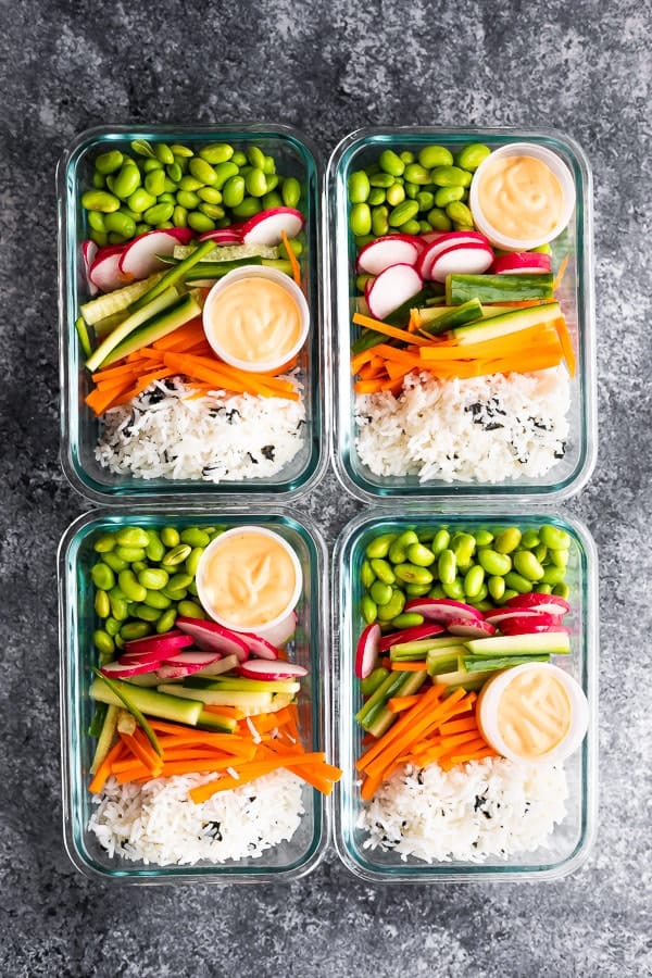 four containers with Vegan Sushi Bowl Meal Prep