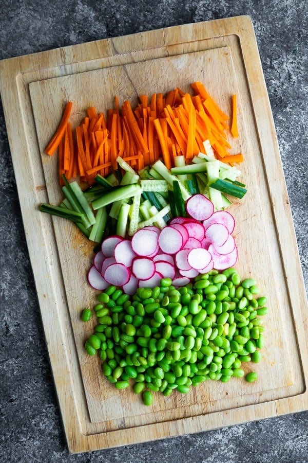 veggies chopped for the Vegan Sushi Bowl Meal Prep on a cutting board