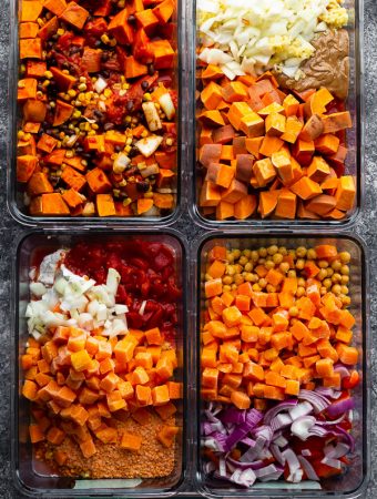 overhead shot of a variety of vegan freezer meals in glass meal prep containers