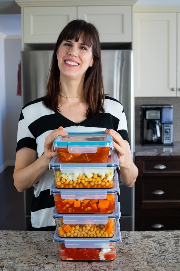 denise with a stack of easy crockpot freezer meals 