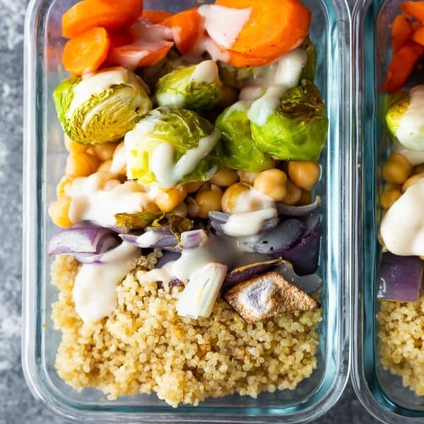 overhead shot of glass meal prep container filled with buddha bowls