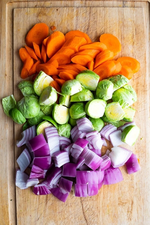 chopped veggies on cutting board for buddha bowl recipes 
