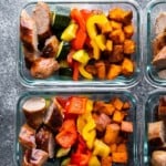 overhead image of glass meal prep containers filled with sheet pan breakfast bake