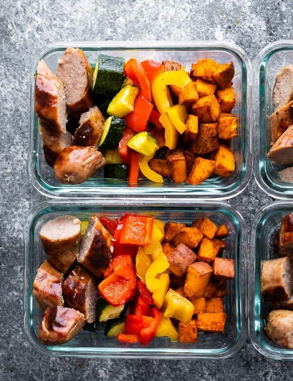overhead image of glass meal prep containers filled with sheet pan breakfast bake