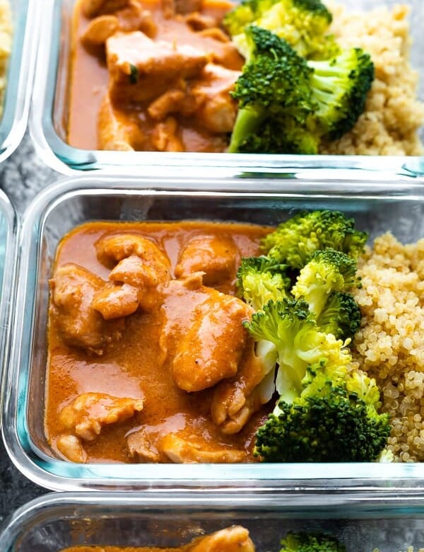 glass meal prep container filled with slow cooker butter chicken and broccoli