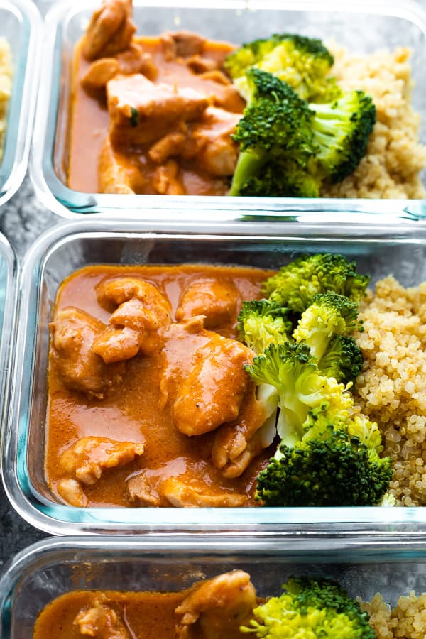 close up shot of slow cooker butter chicken in meal prep containers