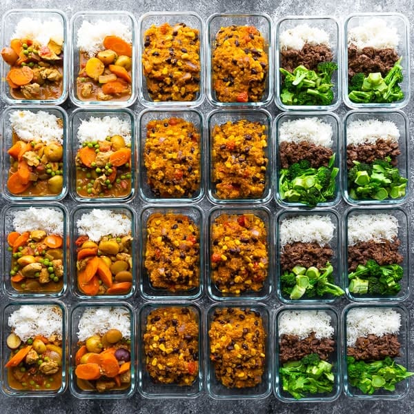 24 meal prep containers filled with cooked meals