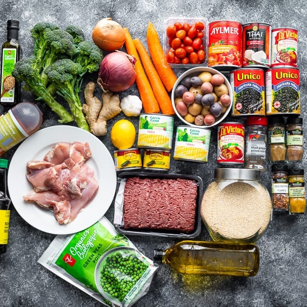 variety of ingredients for freezer friendly lunches on gray countertop