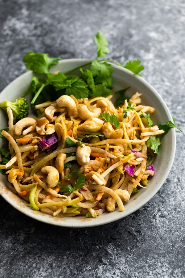 thai salad in bowl with cashews and fresh cilantro