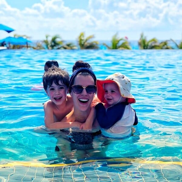 Denise in a pool with her two boys