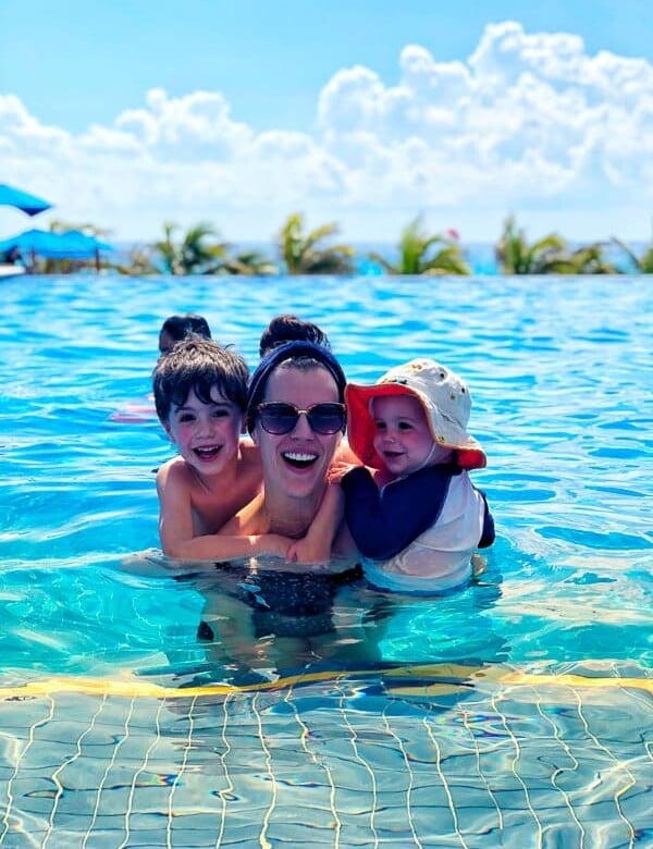 Denise in a pool with her two boys