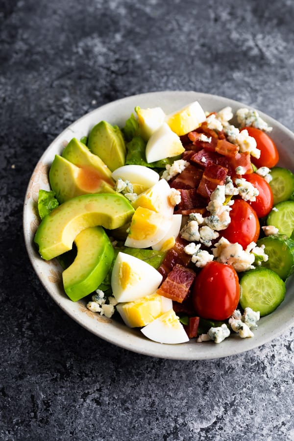 cobb salad dressing drizzled over salad