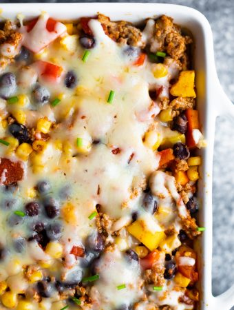 Overhead shot of healthier taco casserole in white casserole dish