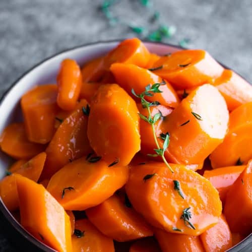 close up shot of a bowl of instant pot carrots with honey glaze