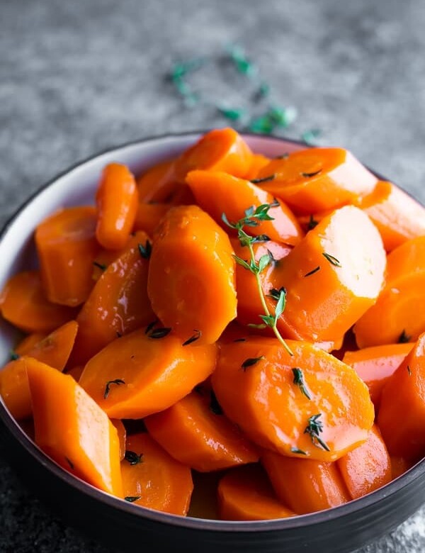 close up shot of a bowl of instant pot carrots with honey glaze