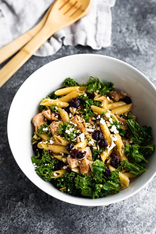 overhead view of chicken pasta salad in white bowl