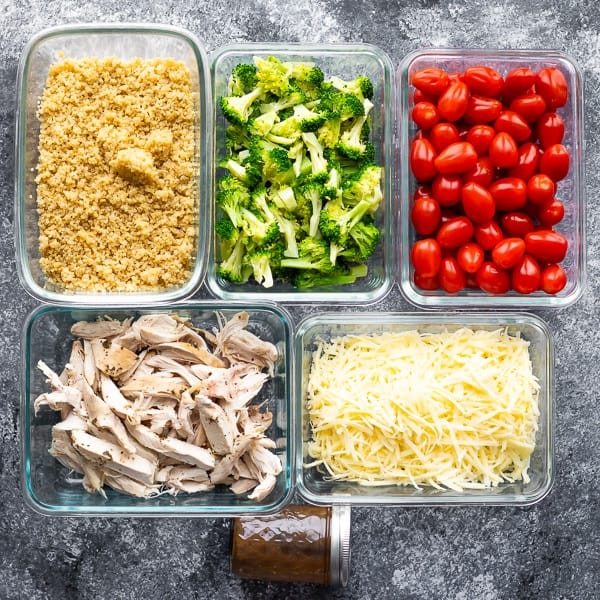 overhead shot of multiple glass meal prep containers filled with various ingredients