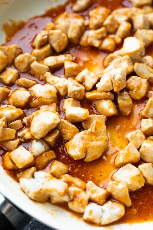 close up view of chicken tossed in barbecue sauce for the lettuce wrap recipe