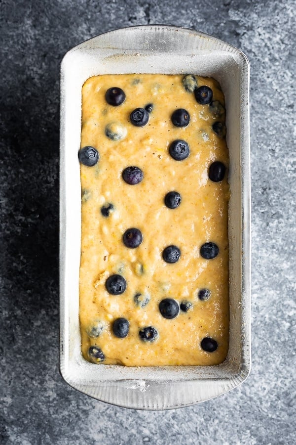 blueberry quick bread batter in loaf pan before baking
