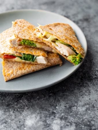 A stack of chicken quesadillas on a gray plate