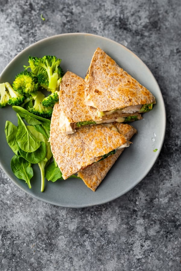 overhead view of healthy quesadilla on plate with vegetables