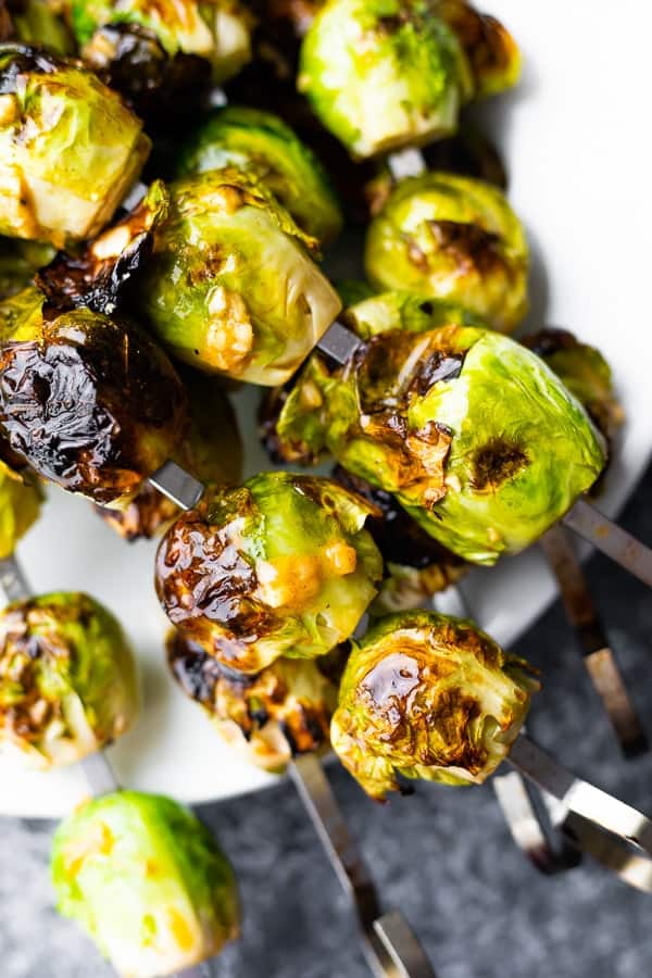 close-up overhead shot of grilled brussel sprouts on plate