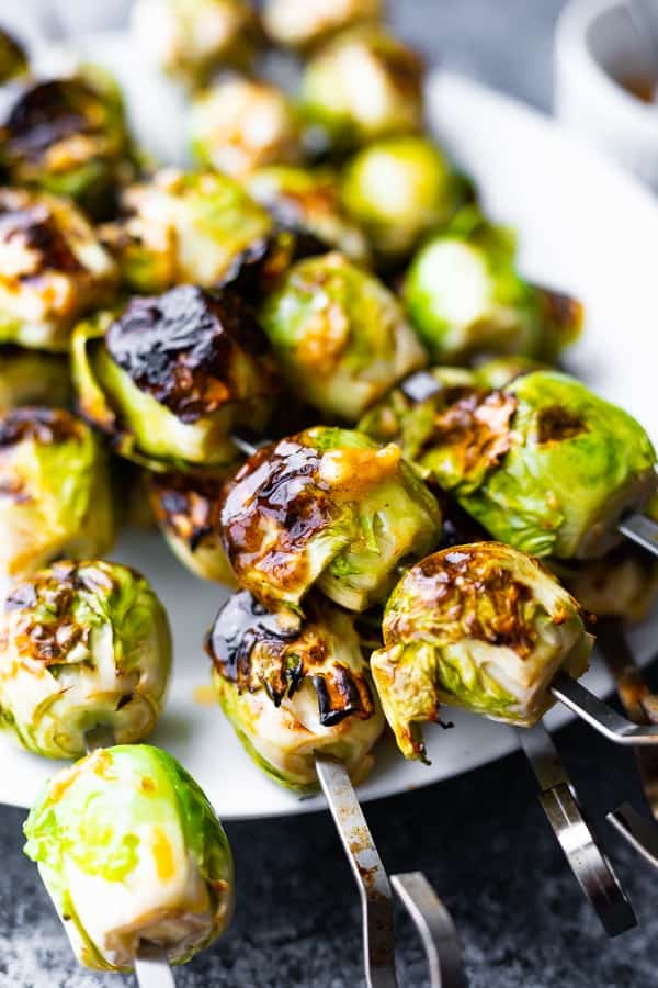 close up of grilled brussel sprouts on plate