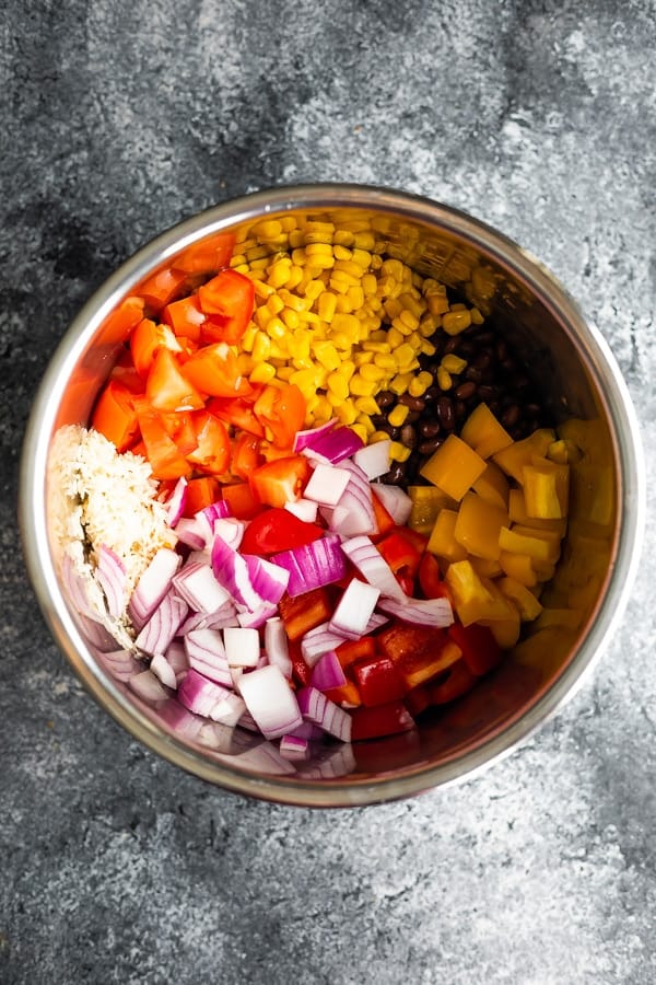 Instant Pot Fiesta Rice Bowls ingredients in inner pot of instant pot before cooking