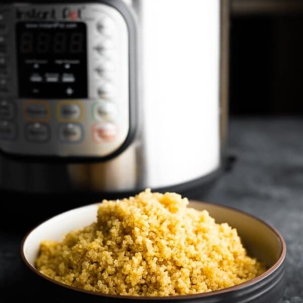 bowl of quinoa in front of an instant pot