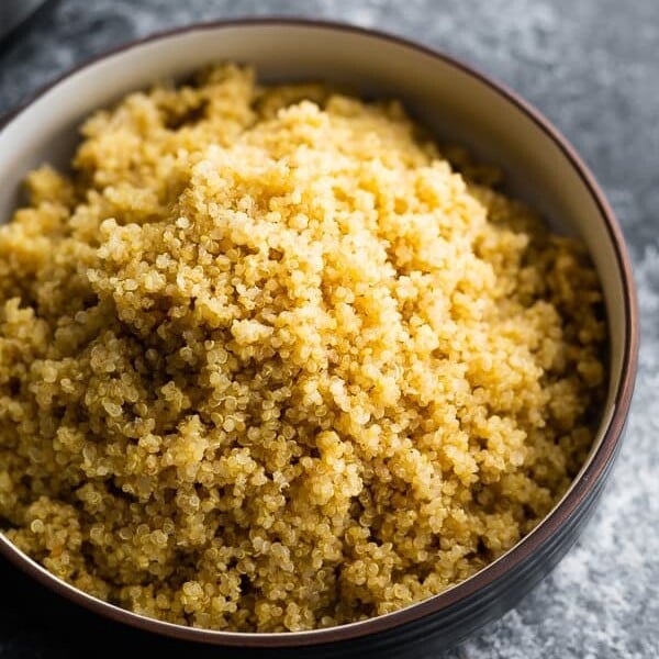 Large black bowl filled with instant pot quinoa