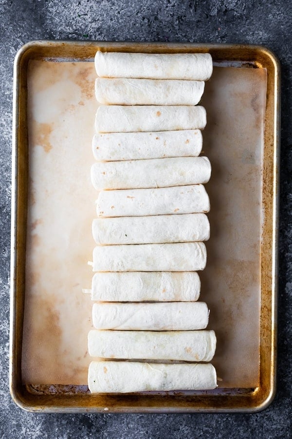 baked breakfast taquitos on sheet pan