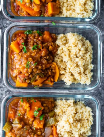 overhead shot of glass meal prep container filled with moroccan instant pot lentils and rice