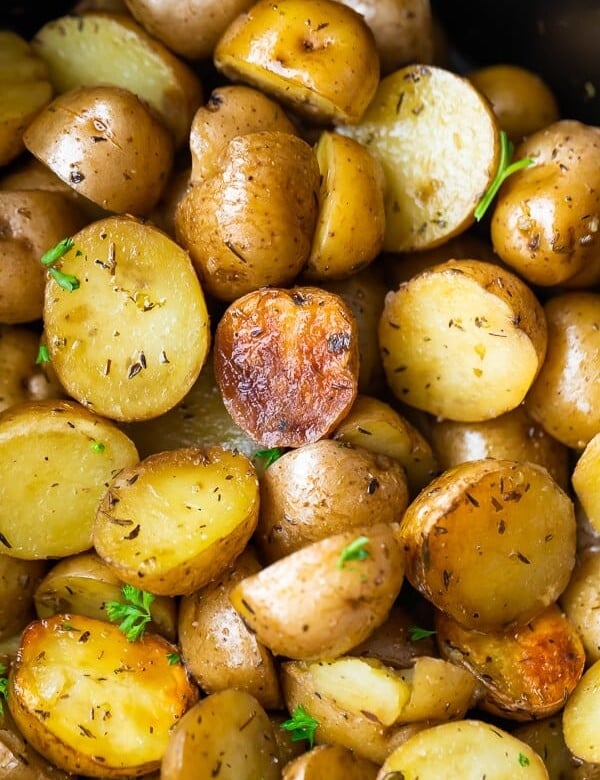 overhead shot of a pile of herb and olive oil crock pot potatoes