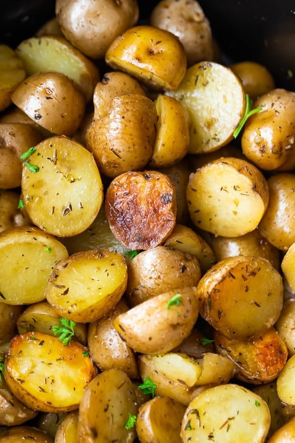 close up of slow cooker potatoes in slow cooker after cooking