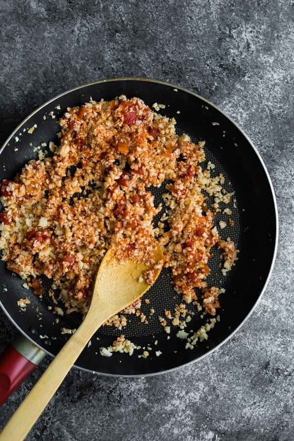 cooking keto mexican cauliflower rice in skillet