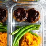 overhead shot of barbecue meatloaf meal prep bowls in glass container