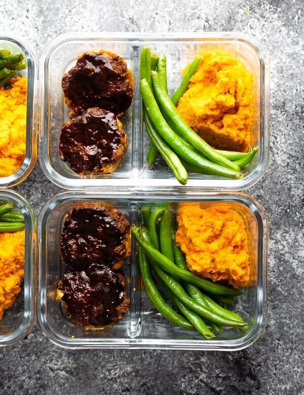 overhead shot of barbecue meatloaf meal prep bowls in glass meal prep containers