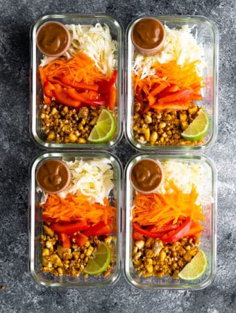 overhead shot of four glass containers filled with tofu spring roll bowls