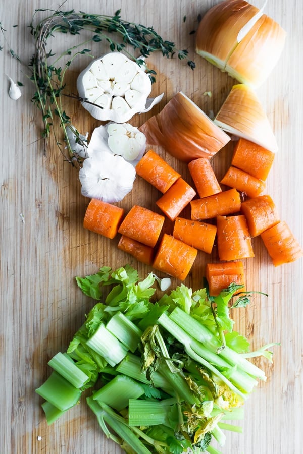 chopped vegetables on cutting board to use in turkey stock