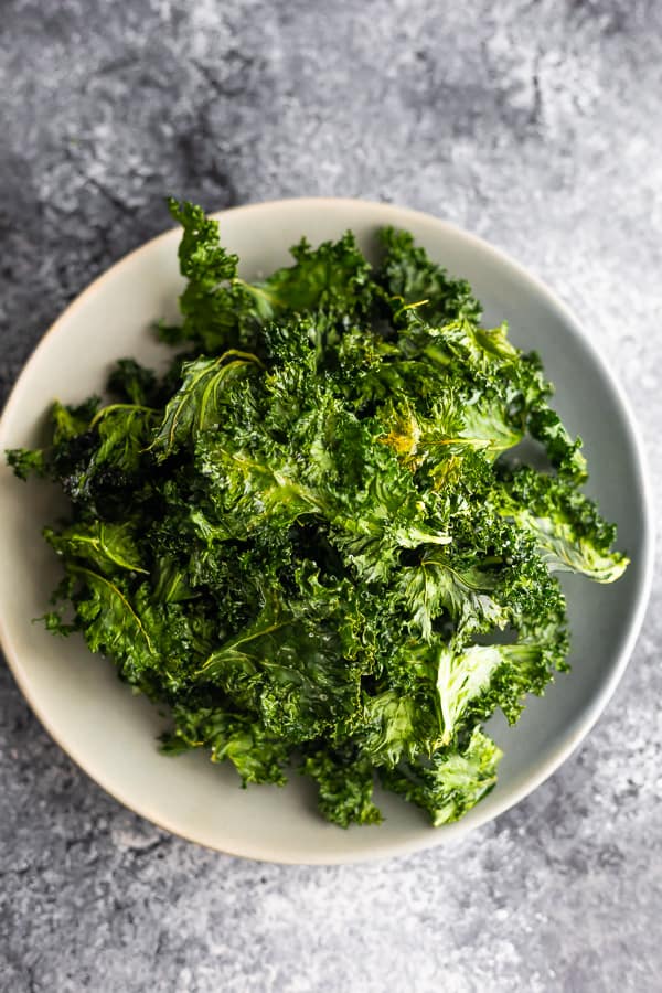 overhead view of a plate full of kale chips