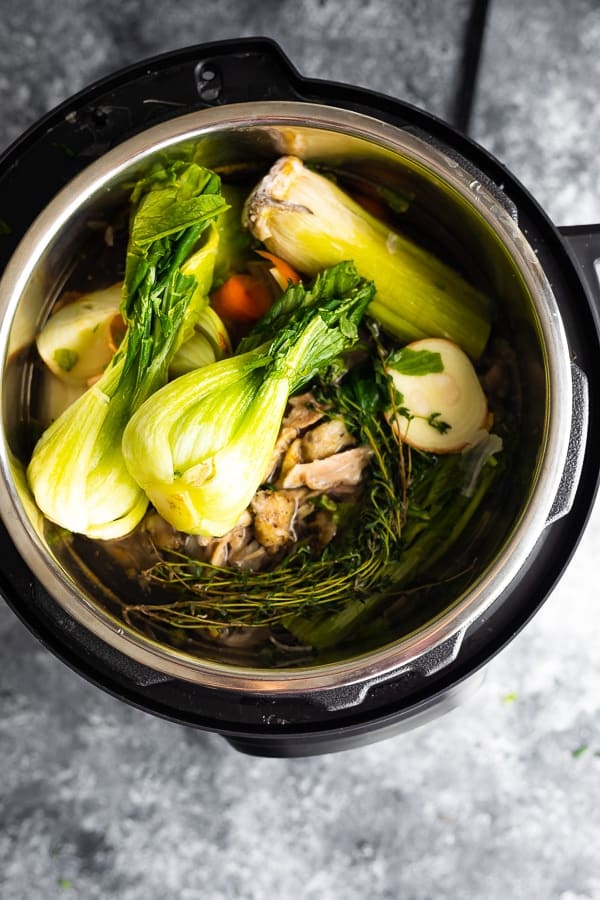 overhead view of ingredients for bone broth in instant pot