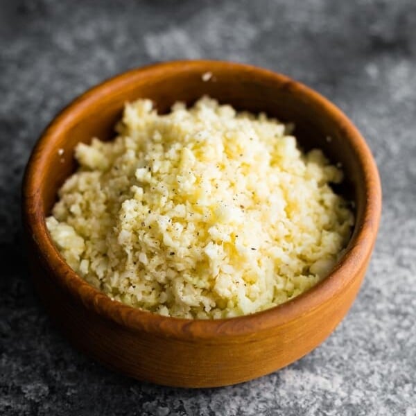 A wood bowl of parmesan cauliflower rice