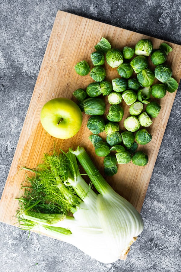 ingredients for the apple slaw on a cutting board