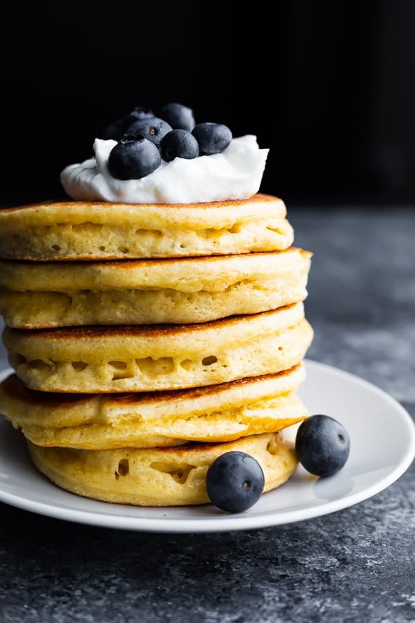 stack of protein powder pancakes on white plate